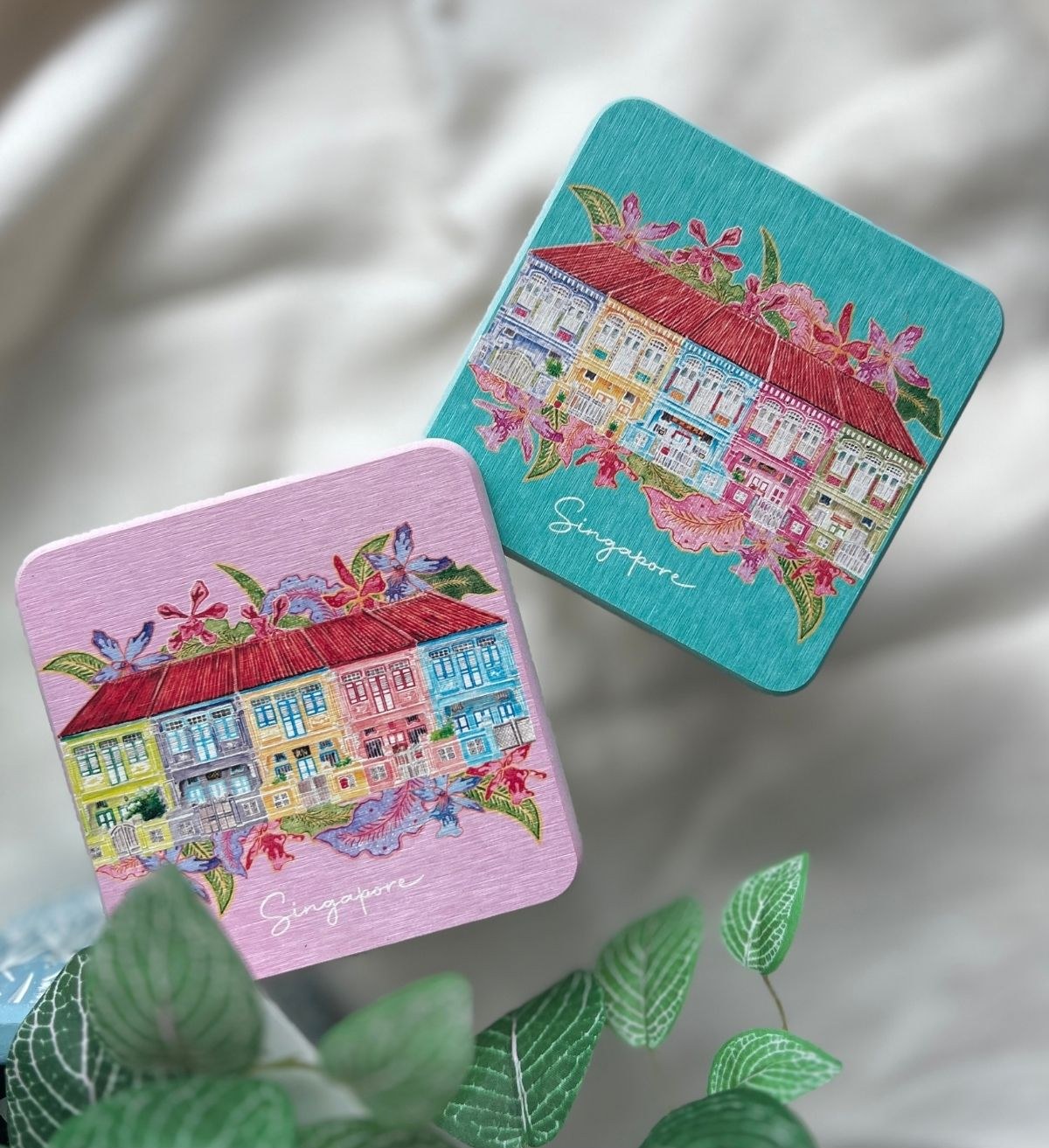 Two Peranakan shophouse-print coasters by Ying in Art