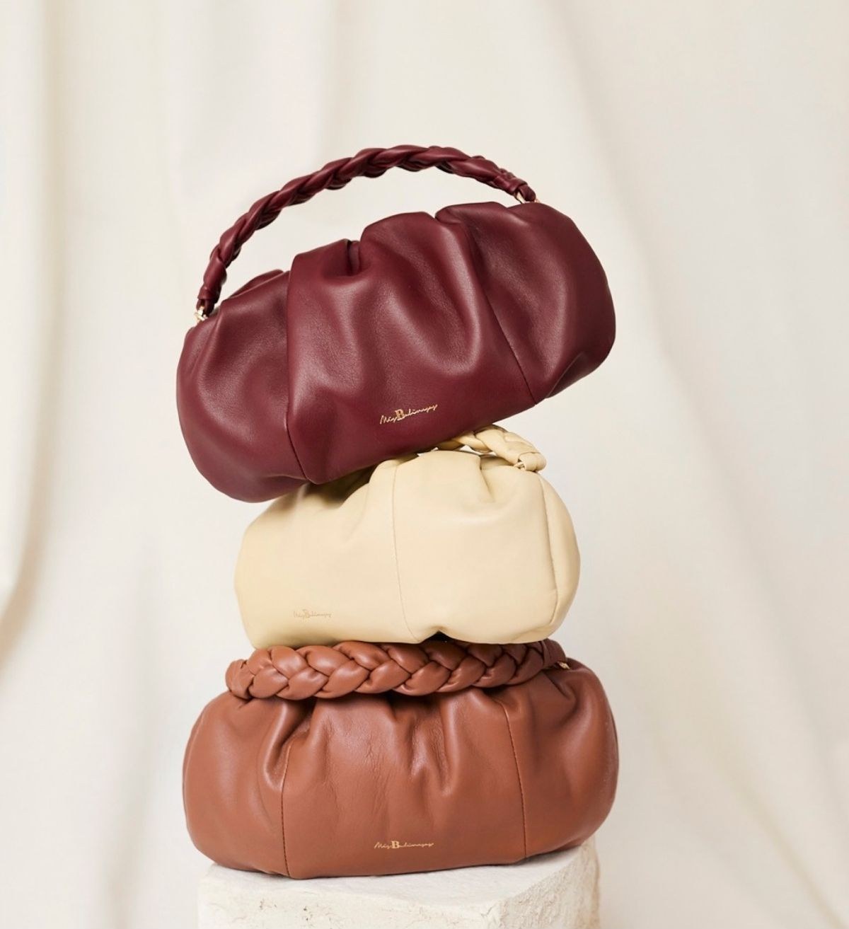 Three stacked leather Mis Balinesas handbags