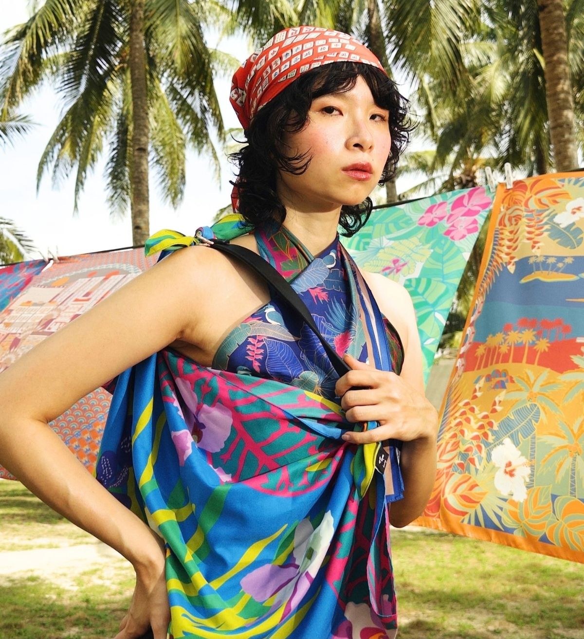 A model wrapped in colourful Binary Style printed scarves