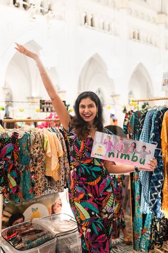 A brand founder celebrating at her stall